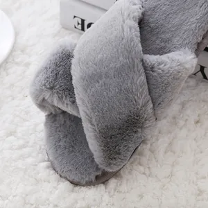 Close-up detail showing the soft plush texture of grey cross strap indoor slippers