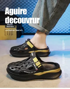 Side view of stylish black and gold clogs for men with breathable hole design.