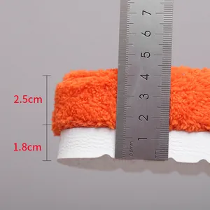 Detailed macro view of plush slipper showing exact sole and fleece thickness measurements