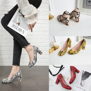Detail view of stylish snakeskin pattern pumps in multiple colors with chunky heels.