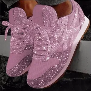Detailed view of pink sparkly sequin platform sneakers for women with glitter finish