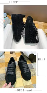 Detailed view of black rhinestone platform sneakers for women featuring sparkly silver laces.