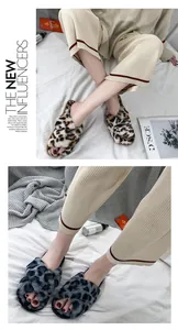 Detail shot of stylish leopard print faux fur open-toe slippers in brown and grey.