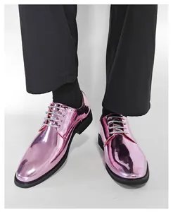 Detailed view of shiny metallic pink dress shoes for men's formal or performance wear