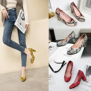 Detailed view of fashionable snake skin pattern chunky heel pumps in multiple vibrant colors