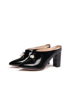 Side view of black patent leather pointed-toe mules with pearl beads and block heels