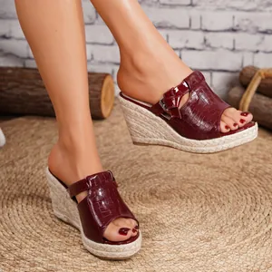 Elegant maroon crocodile texture open-toe wedge sandals with a straw-woven platform sole