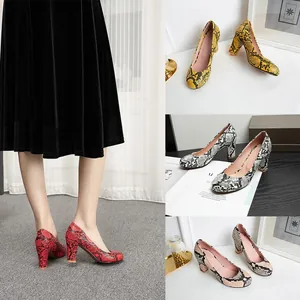 Elegant snake skin pattern chunky heel pumps available in red, yellow, black and beige colors