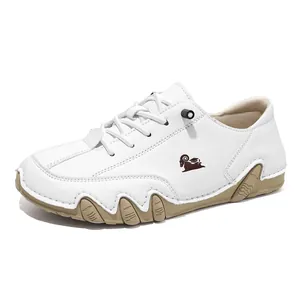 Comfortable white wide-fit low-top casual shoes featuring a unique octopus-style rubber sole