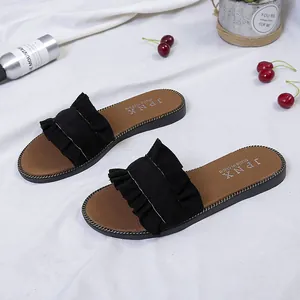 Elegant women's black ruffled flat sliders for summer beach leisure and casual outdoor wear