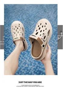 Macro view of beige men's garden clogs featuring breathable holes and brown straps