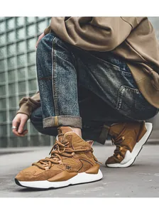 Brown leather casual dad sneakers for men shown in an urban street lifestyle setting