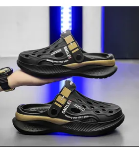 Side view of men's black sports clogs showing thick sole and dual-use heel strap