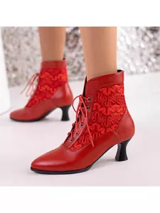 Elegant red Victorian lace-up ankle boots featuring detailed embroidery and pointed toe