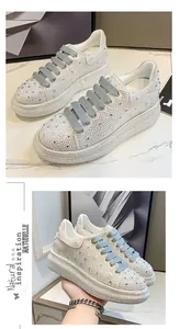 Detail of women's chunky platform sneakers with full rhinestone embellishment.