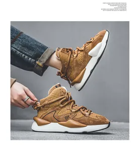 Detail view of brown high-top leather sneakers with textured patterns and thick white soles