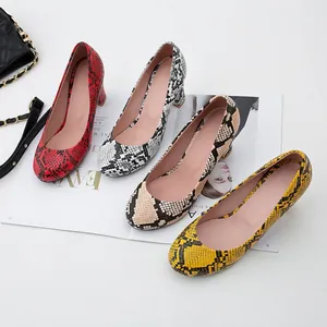 Stylish women's snakeskin pattern pumps featuring a round toe and chunky mid-heel