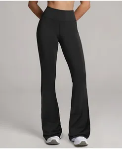 Front view showing the fit of professional high-waisted black flared yoga pants on model