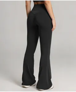 Detailed back view of black high-waisted flared yoga pants showing hip-lifting design.