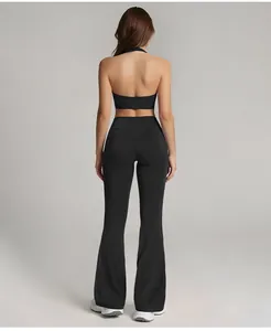 Detailed rear view of black high waisted flared yoga pants and matching halter top