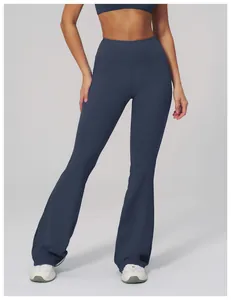 Detail showing navy blue high-waisted yoga flare pants made from soft cloud-feel fabric