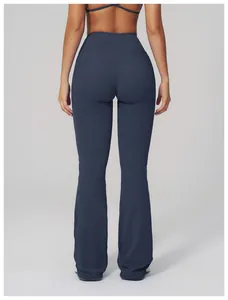 Rear view of high-waisted yoga flared pants in navy blue with body-shaping fit