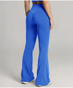 Back view of high-waist blue flared yoga pants showing butt lifting design and flared leg.