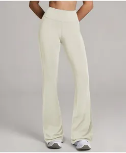 High-waisted cream flare yoga pants showing the wide-leg cut and smooth fabric texture.