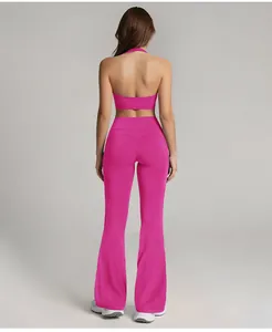 Professional back view of magenta high waist flare yoga leggings and halter top set