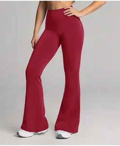 Full length detail of wine red high-waisted flared yoga pants featuring butt lift design.