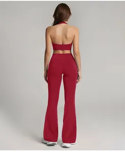 Detailed back view of burgundy high-waisted flared sports leggings and halter top set