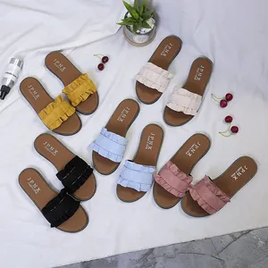 Stylish women's ruffled flat slippers in multiple colors for casual summer beach wear