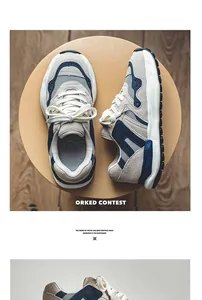 Top view of chunky beige and navy blue dad sneakers on a minimalist round yellow stool