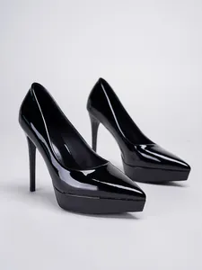 Side view detail of shiny black patent leather pointed toe platform pumps