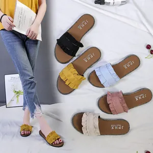 Summer women's flat slide sandals with stylish ruffle edges in multiple colors.