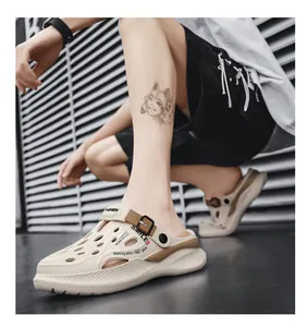 Detail view of breathable beige men's garden clogs with casual SMILE print.
