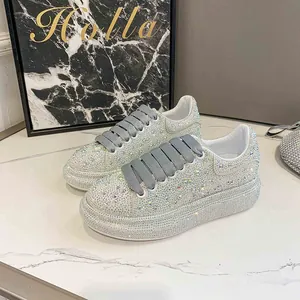 Detailed macro shot of sparkling rhinestone platform sneakers with grey wide laces