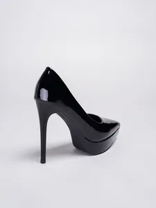 Close-up of black patent leather stiletto pumps with high platform