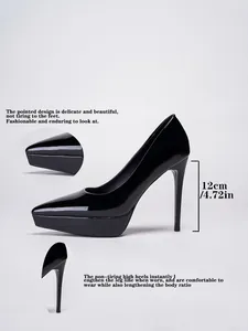 Detail view of 12cm black patent leather platform high heels with pointed toe