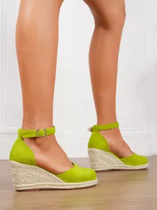 Detail view of lime green wedge espadrille sandals with ankle strap and woven sole