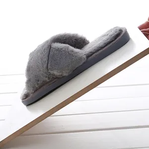 Close-up of grey plush platform slipper showing thick sole and non-slip texture