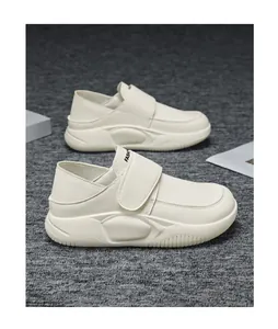 Side view of cream leather casual work shoes with adjustable hook-and-loop strap