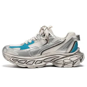 Stylish men's silver chunky sneakers with thick soles and breathable mesh panels