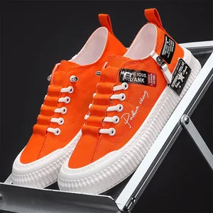 Vibrant orange men's canvas sneakers with thick white anti-slip platform soles.