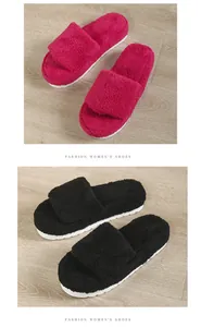 Detail view of plush toweling slippers in rose red and black with platform soles