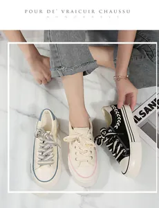 Detail showing platform canvas sneakers with stylish chunky laces in multiple colors