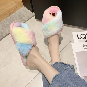 Detailed view of colorful rainbow faux fur cross-strap slippers showing soft texture and fit
