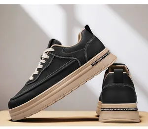 Detailed close-up view of men's black leather casual sneakers with thick beige soles