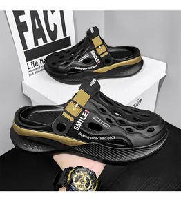 Close-up of black and gold men's clogs sandals featuring breathable holes and strap