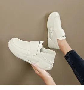 Side view detail of white platform leather work shoes for women with velcro strap